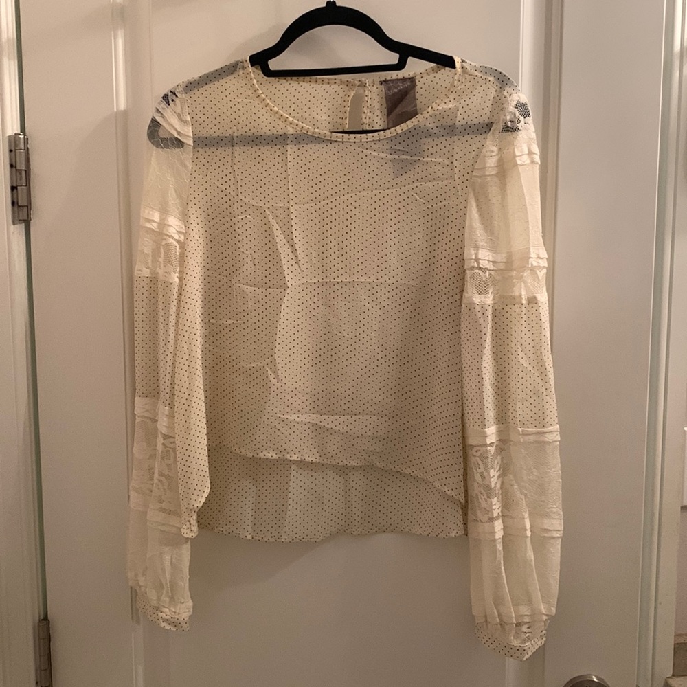 Polka dot top with lace sleeves